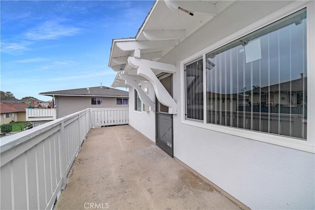 view of patio featuring a balcony