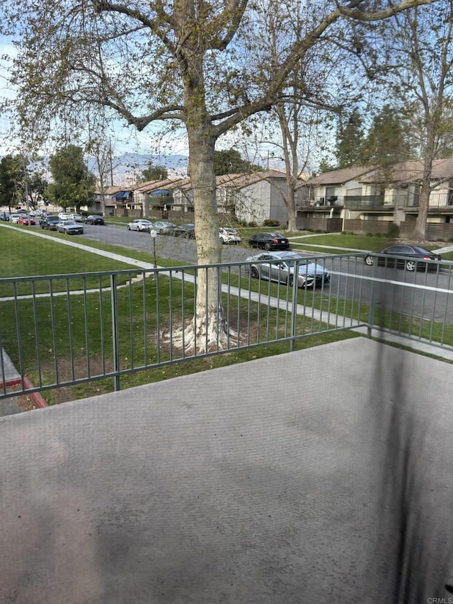 1169EAST Cornell Ave Unit 52, Redlands, CA 92374 - view of patio / terrace with a residential view and fence