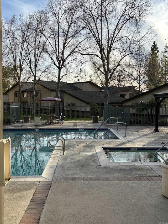 1169EAST Cornell Ave Unit 52, Redlands, CA 92374 - pool with a community hot tub, a patio area, and fence