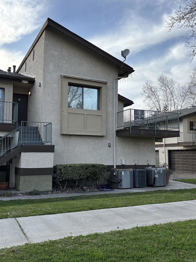 1169EAST Cornell Ave Unit 52, Redlands, CA 92374 - view of property exterior featuring central AC unit and stucco siding