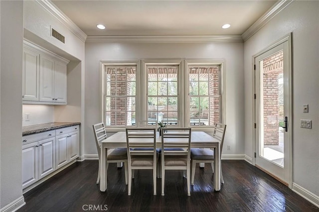 4 Andromeda Isle, Ladera Ranch, CA 92694 - dining space with dark wood-type flooring and ornamental molding