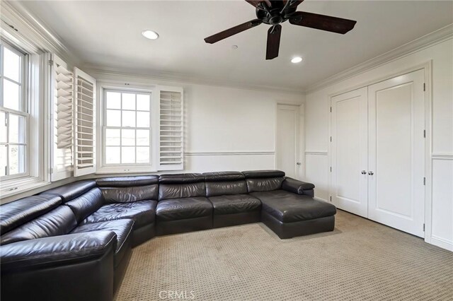 living area featuring recessed lighting, carpet floors, a ceiling fan, and ornamental molding