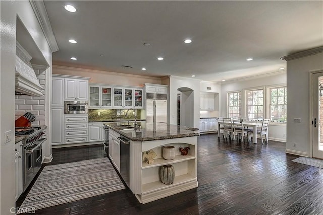 4 Andromeda Isle, Ladera Ranch, CA 92694 - kitchen with a sink, open shelves, crown molding, high quality appliances, and white cabinets