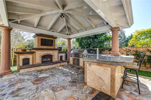 4 Andromeda Isle, Ladera Ranch, CA 92694 - view of patio featuring an outdoor fireplace, a gazebo, grilling area, and an outdoor kitchen