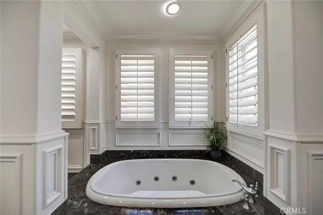 4 Andromeda Isle, Ladera Ranch, CA 92694 - full bath featuring a decorative wall, a whirlpool tub, crown molding, and a wainscoted wall
