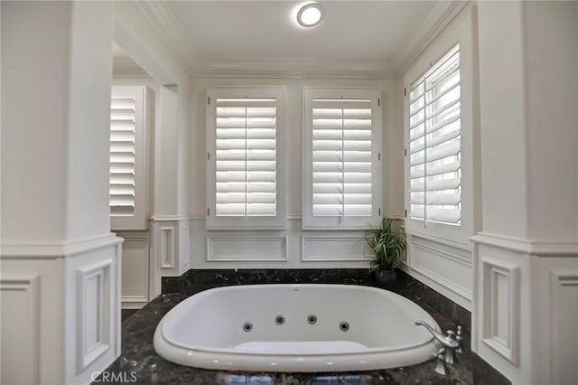 4 Andromeda Isle, Ladera Ranch, CA 92694 - full bathroom with a decorative wall, a whirlpool tub, crown molding, and wainscoting