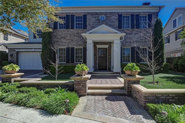 4 Andromeda Isle, Ladera Ranch, CA 92694 - colonial-style house with brick siding and a garage
