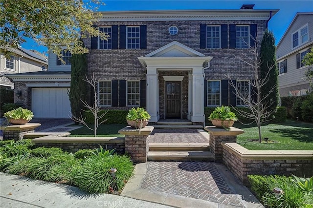 4 Andromeda Isle, Ladera Ranch, CA 92694 - colonial-style house featuring brick siding and an attached garage