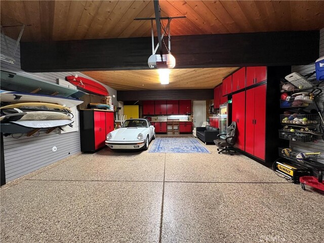 garage featuring wooden ceiling and a garage door opener