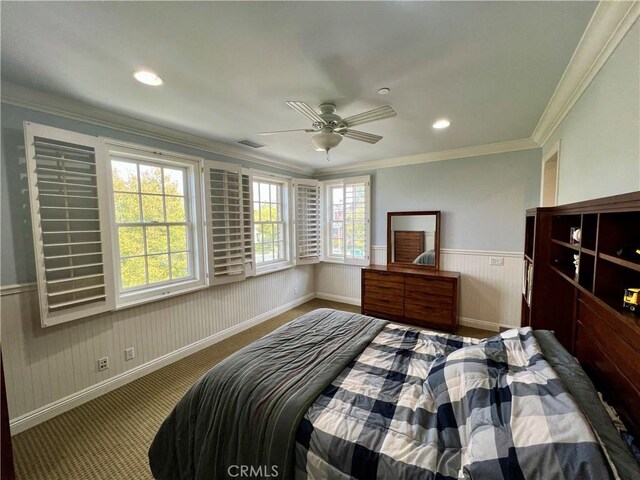 bedroom with recessed lighting, carpet floors, visible vents, and a wainscoted wall