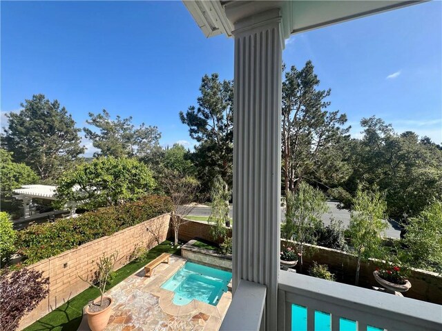 view of swimming pool featuring a patio area and a fenced backyard