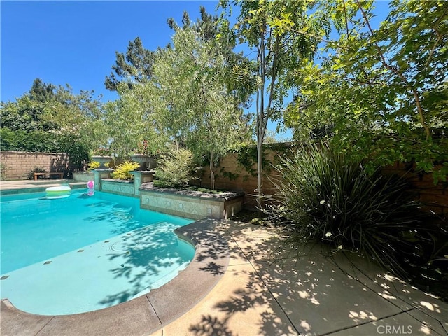 4 Andromeda Isle, Ladera Ranch, CA 92694 - view of pool featuring a fenced backyard and a patio area