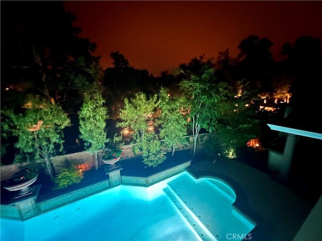 4 Andromeda Isle, Ladera Ranch, CA 92694 - pool at twilight with a swimming pool