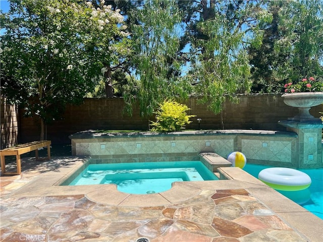 4 Andromeda Isle, Ladera Ranch, CA 92694 - view of pool featuring a fenced backyard and an in-ground hot tub