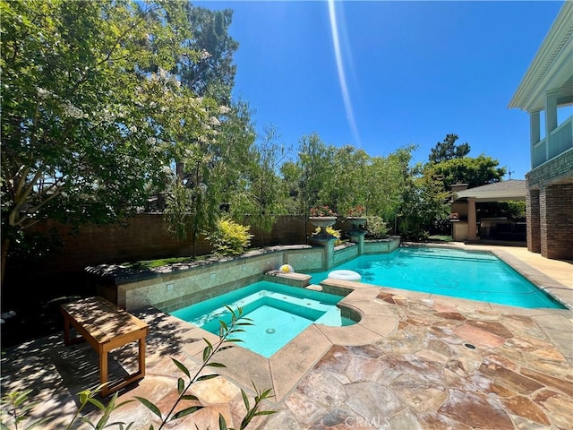 4 Andromeda Isle, Ladera Ranch, CA 92694 - view of pool with a patio area, a fenced backyard, and a pool with connected hot tub
