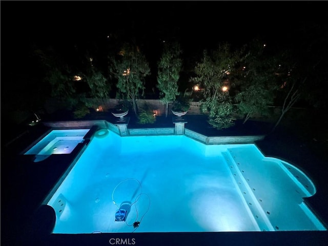 4 Andromeda Isle, Ladera Ranch, CA 92694 - pool at twilight with a pool with connected hot tub