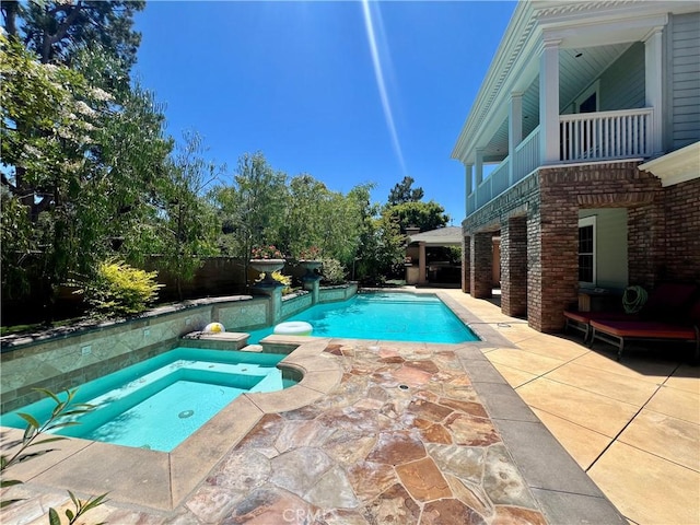 4 Andromeda Isle, Ladera Ranch, CA 92694 - view of swimming pool with a patio area and a pool with connected hot tub