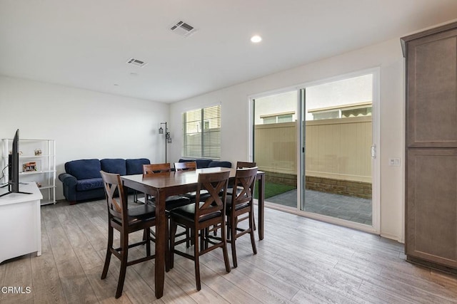 dining area with recessed lighting, visible vents, and light wood-style flooring