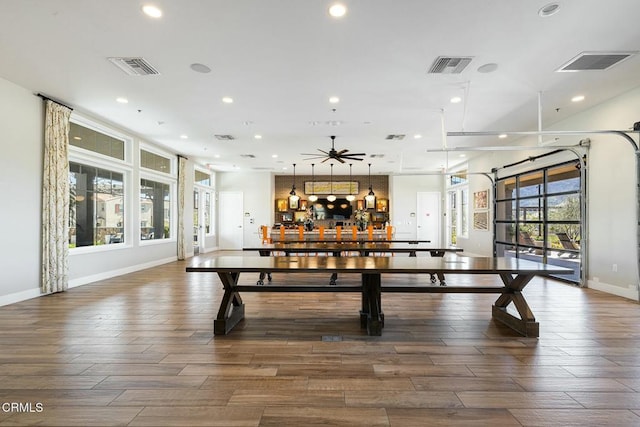 recreation room featuring recessed lighting, visible vents, baseboards, and wood finished floors