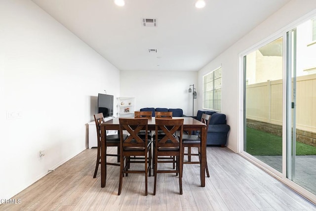 dining space featuring recessed lighting, light wood-type flooring, and visible vents