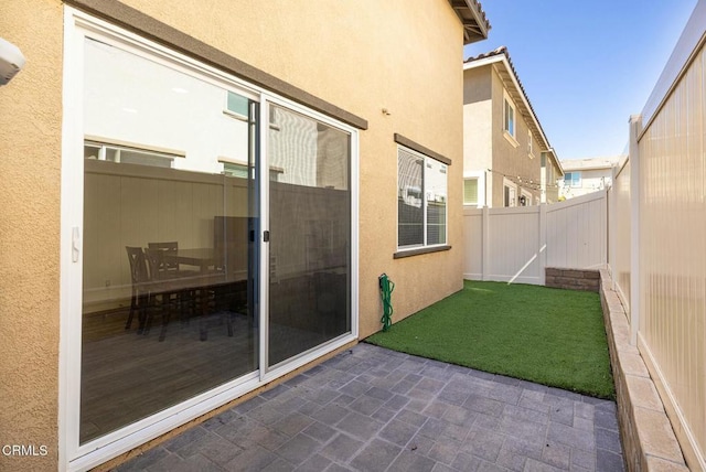 view of yard featuring a patio and a fenced backyard