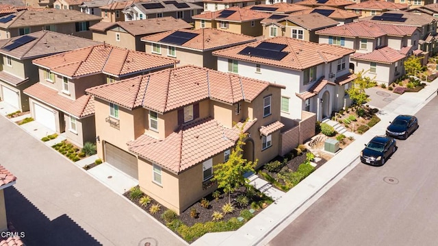 birds eye view of property with a residential view