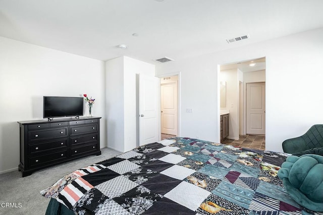 carpeted bedroom featuring visible vents and baseboards