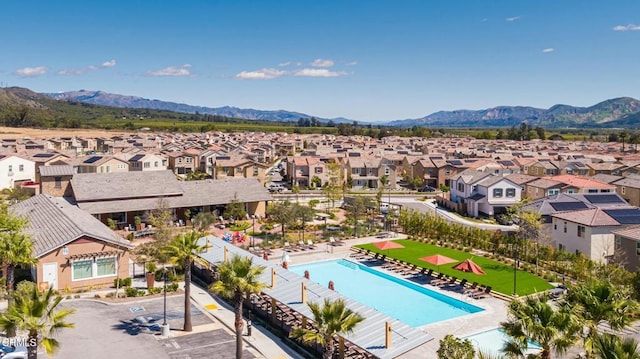 drone / aerial view featuring a residential view and a mountain view