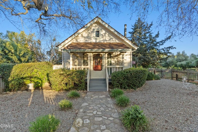 view of front of property featuring fence