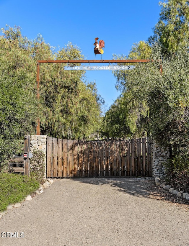 view of gate featuring fence