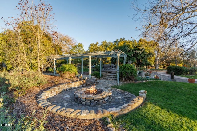 view of yard featuring a fire pit and a pergola