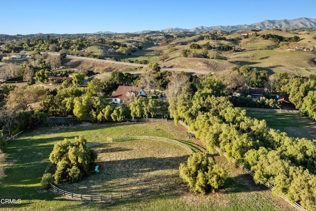 birds eye view of property featuring a mountain view