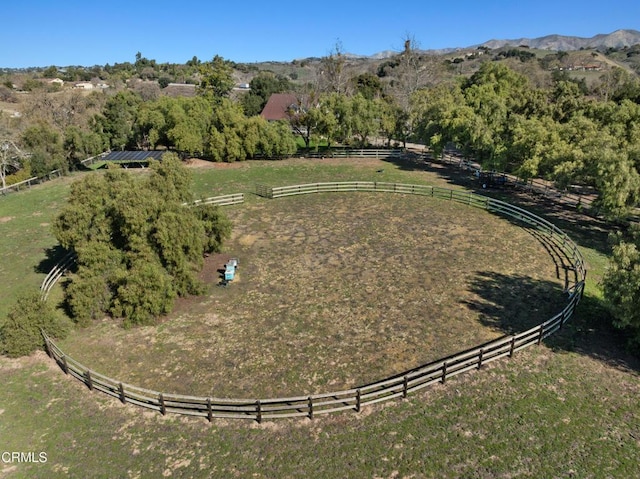 drone / aerial view featuring a mountain view and a rural view