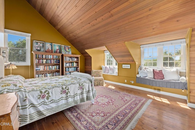 bedroom with visible vents, baseboards, vaulted ceiling, wooden ceiling, and wood-type flooring