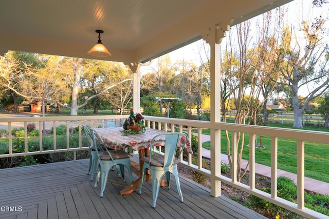 wooden deck featuring outdoor dining space