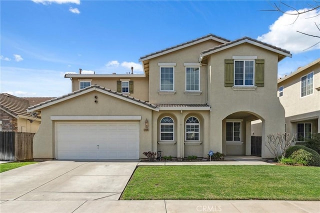 traditional-style home featuring fence, stucco siding, concrete driveway, a garage, and a tile roof