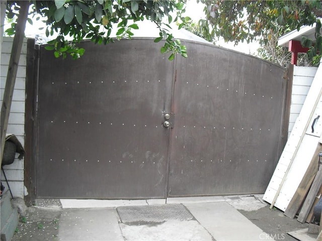 view of gate featuring fence