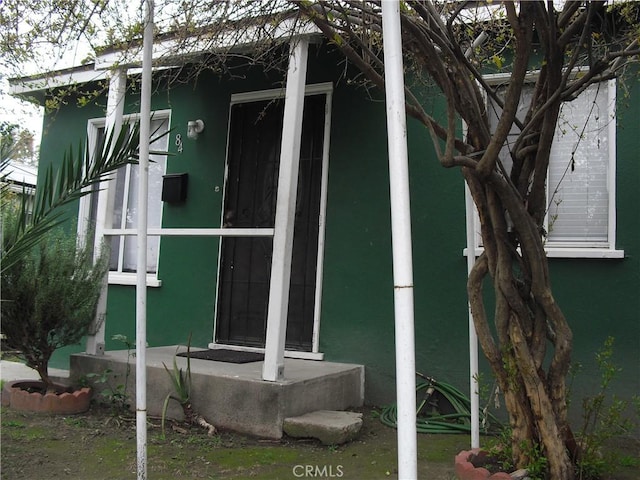view of side of property with stucco siding