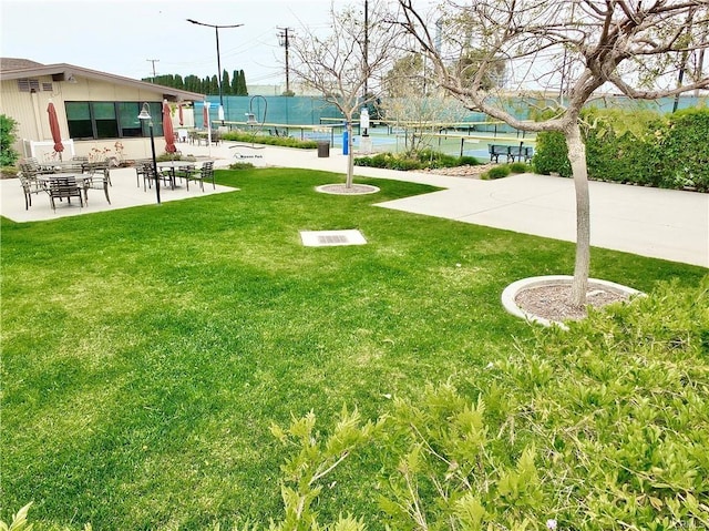 view of yard featuring a patio and fence