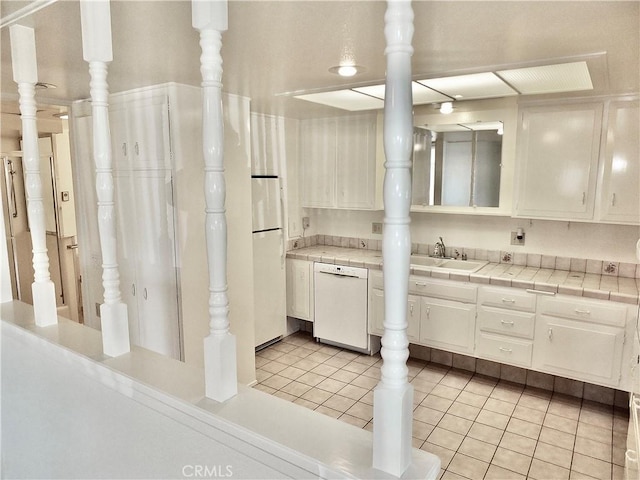 bathroom with tile patterned flooring and vanity