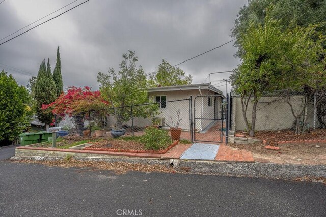 10670 Olive Grove Ave, Sunland, CA 91040 - view of front facade featuring a gate and fence