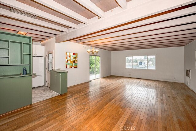 10670 Olive Grove Ave, Sunland, CA 91040 - empty room with beam ceiling, a chandelier, healthy amount of natural light, and light wood-type flooring