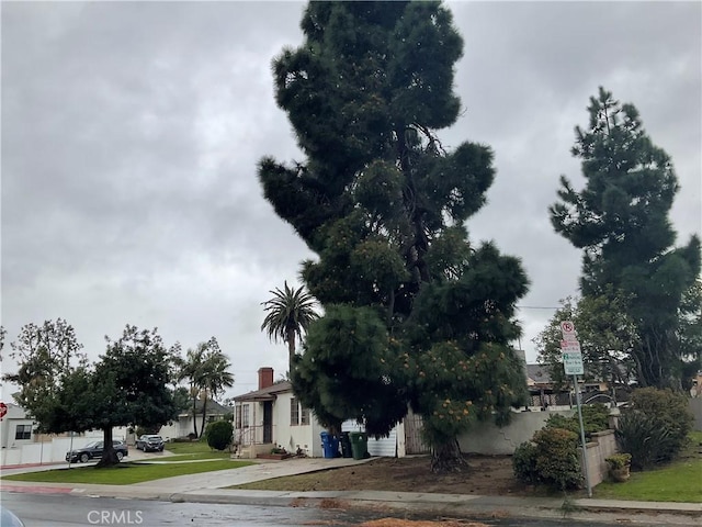 view of road featuring curbs, traffic signs, and sidewalks