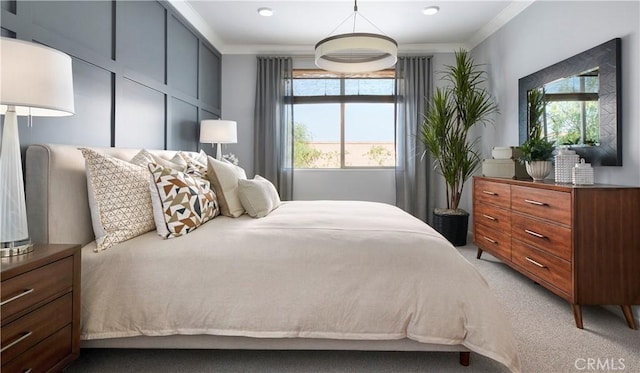 bedroom with multiple windows, light colored carpet, and ornamental molding