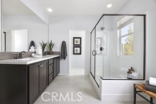 full bath featuring recessed lighting, a stall shower, and vanity