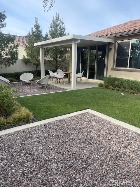 view of yard featuring a patio and fence