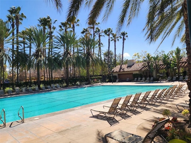 community pool with a patio area