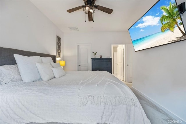 bedroom featuring carpet flooring, visible vents, baseboards, and ceiling fan