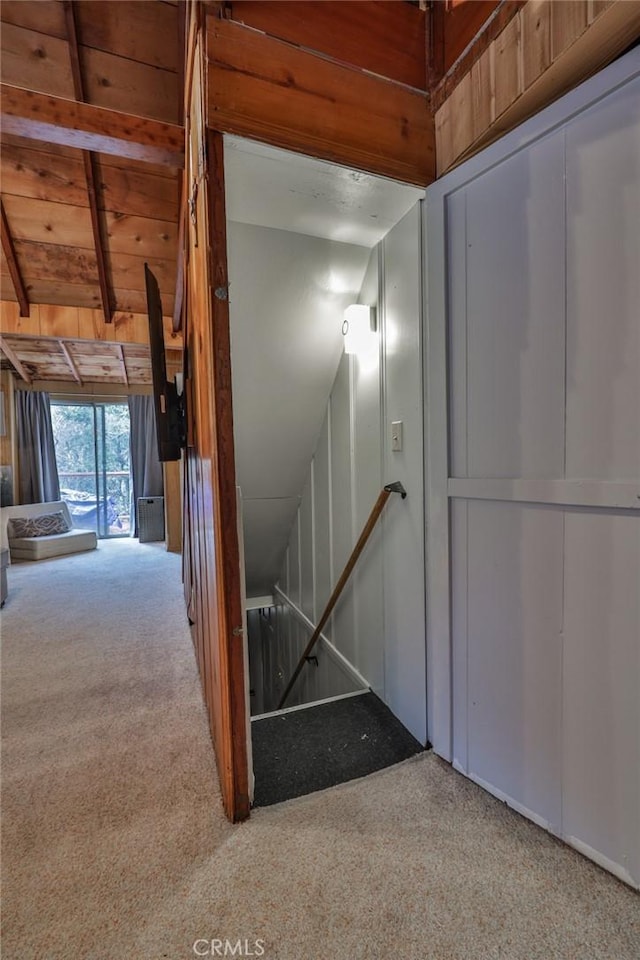 23679 Hillside Dr, Crestline, CA 92325 - stairway with carpet floors, wooden ceiling, and lofted ceiling with beams