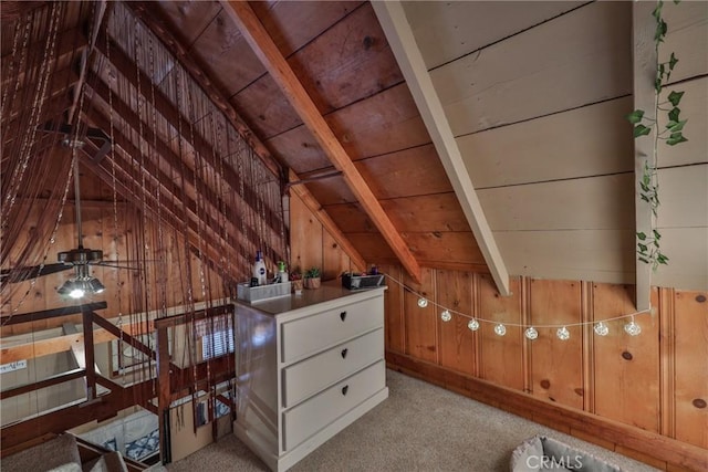 23679 Hillside Dr, Crestline, CA 92325 - interior space featuring wooden walls, light colored carpet, wood ceiling, and vaulted ceiling with beams